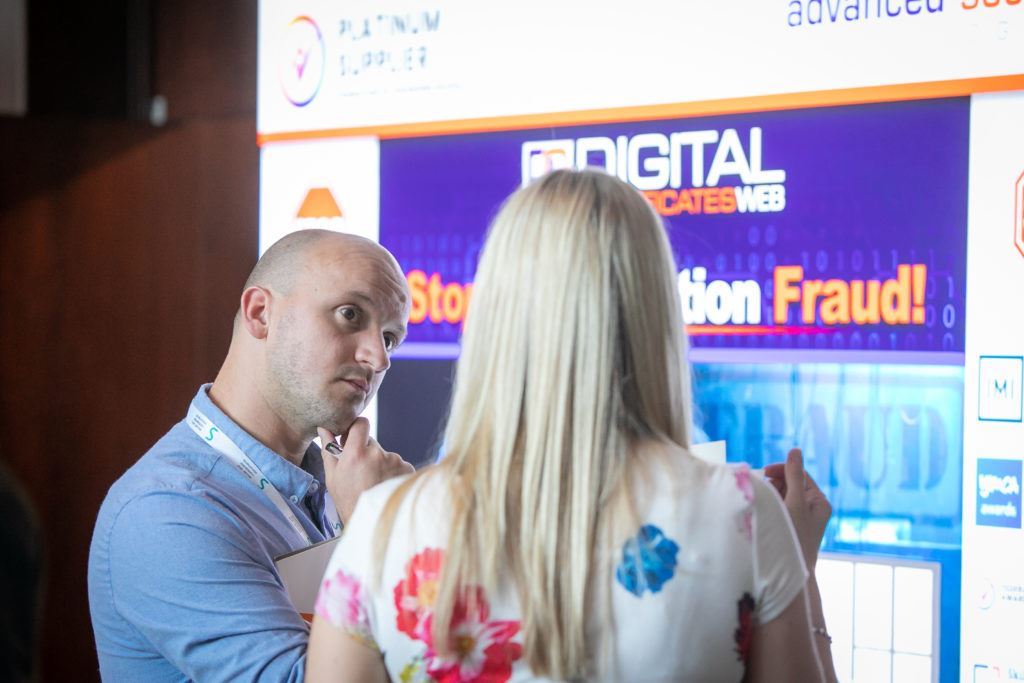 Our Director speaking to a customer at the FAB 2019 conference by our branded Advanced Secure Technologies exhibition stand.