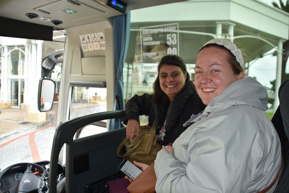 Delegates in bus smiling