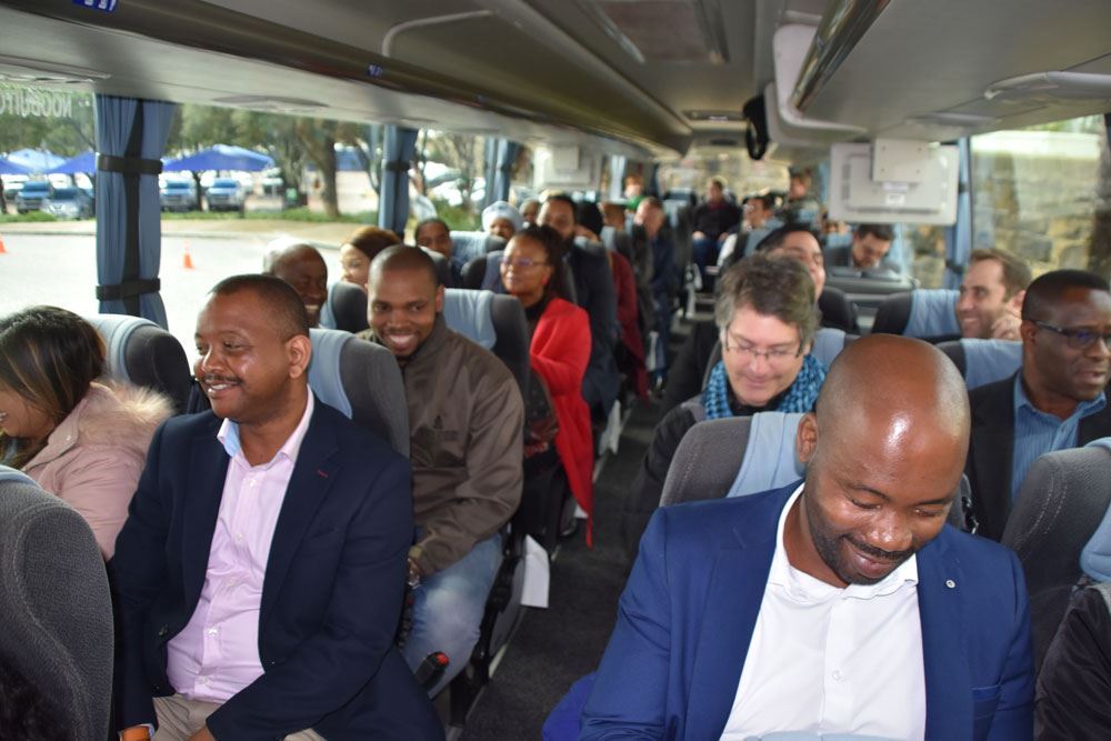 Delegates in bus on trip through cape town.