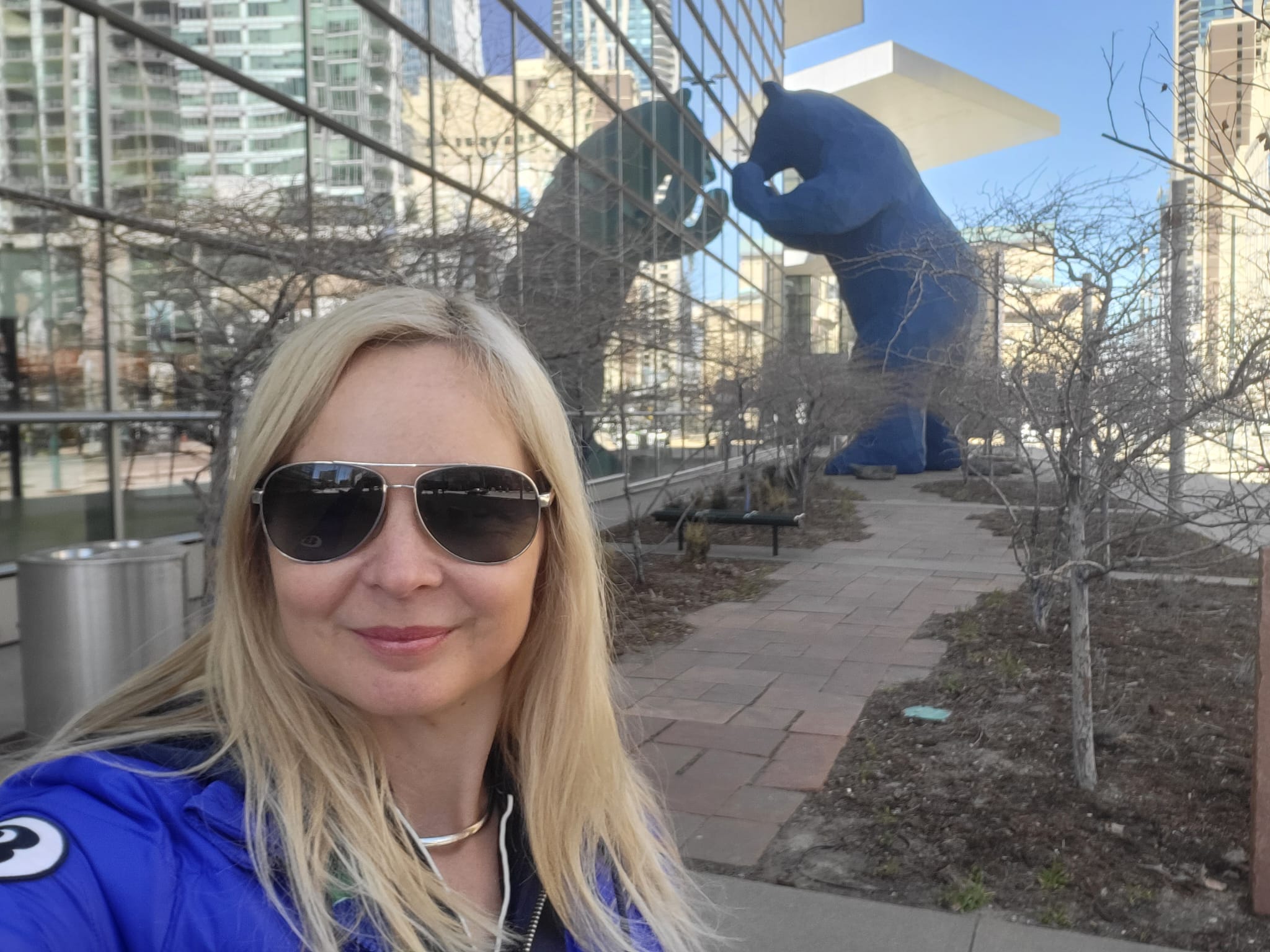 Georgina - director in front of big blue bear