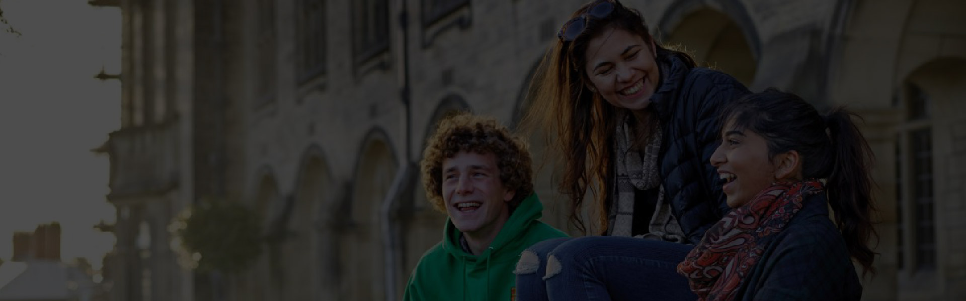 Bangor University Banner with happy students - degree documents