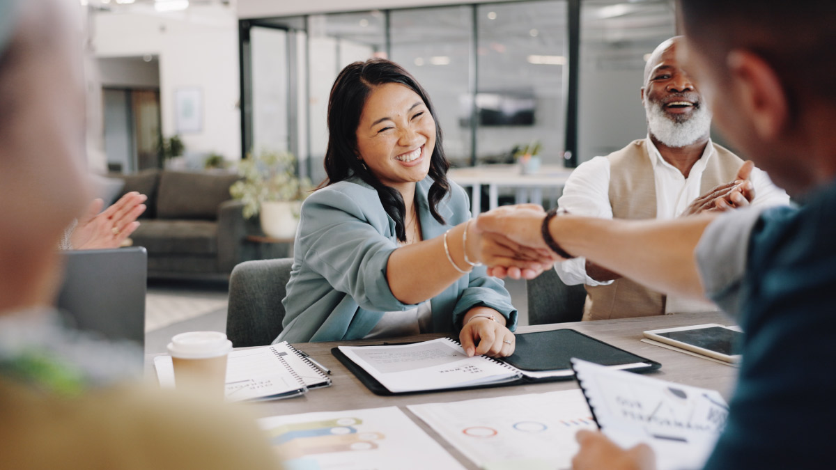 Student / Graduate Shaking hands with employer / third party getting employed