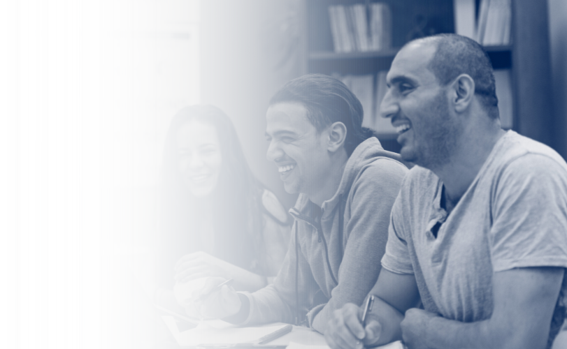 Learners in a classroom laughing